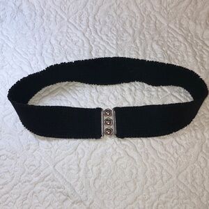 Vintage stretch belt with silver tone metal clasp, made in USA, black